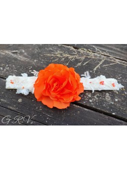 Gelsva galvajuostė su oranžine gėle