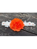 Gelsva galvajuostė su oranžine gėle