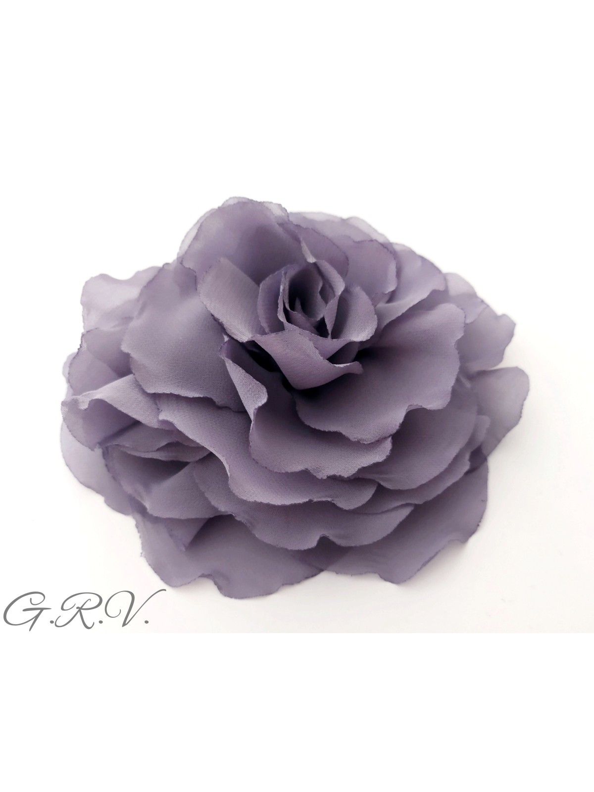 Pilkšvai violetinės spalvos gėlė - segė
